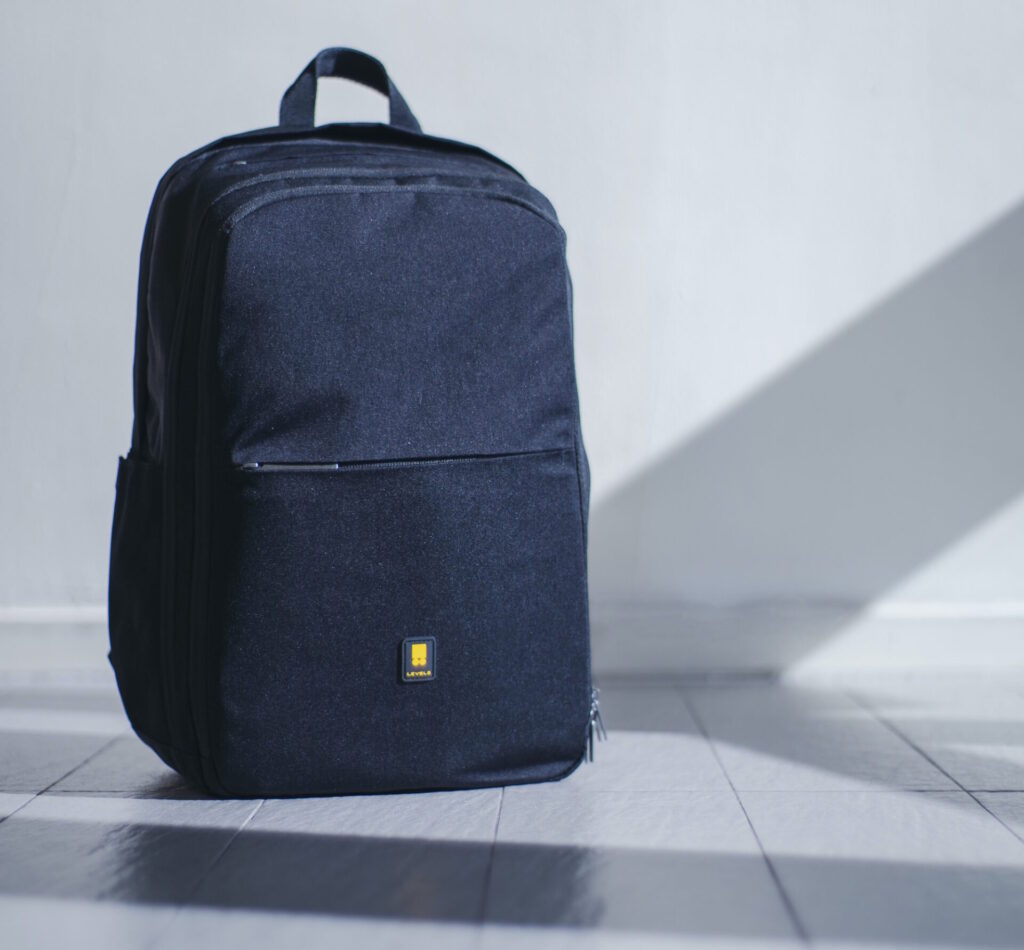 A picture of a backpack against a grey background